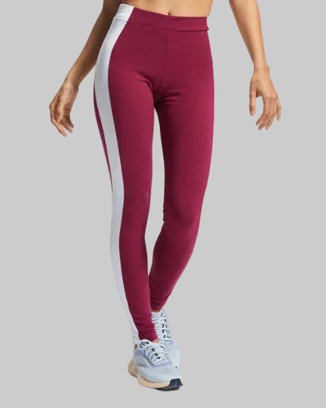 Maroon leggings with white side stripes worn by a person on a light gray background