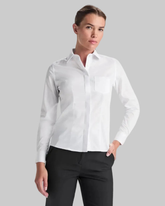 Woman wearing a white button-up shirt and black pants on a white background