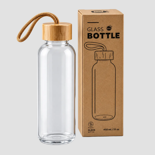 A clear glass water bottle with a light wood cap and a tan rope loop handle, shown next to its brown kraft paper packaging box on a light gray background.