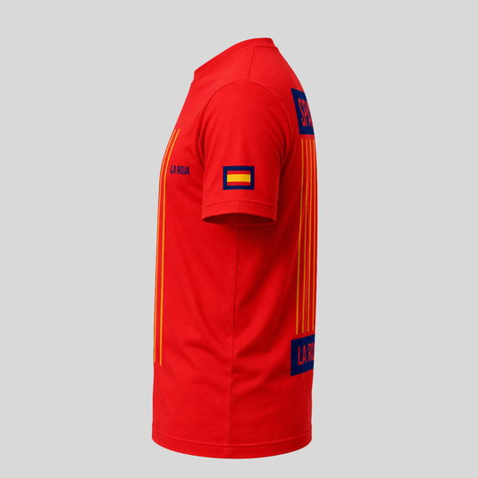 Red sports jersey with yellow stripes and a flag patch on a gray background