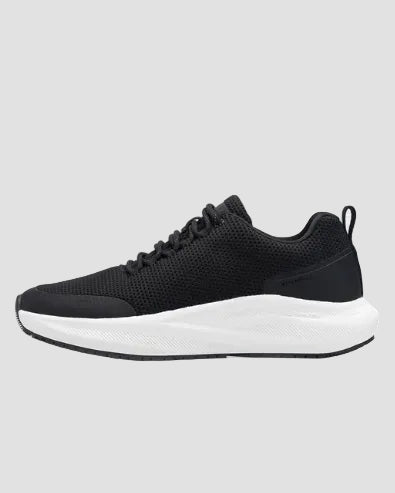 A Nike running shoe in black and white, shown from a side profile view on a clean white background.